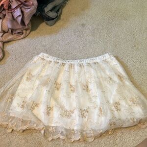 White skirt with gold detailing
